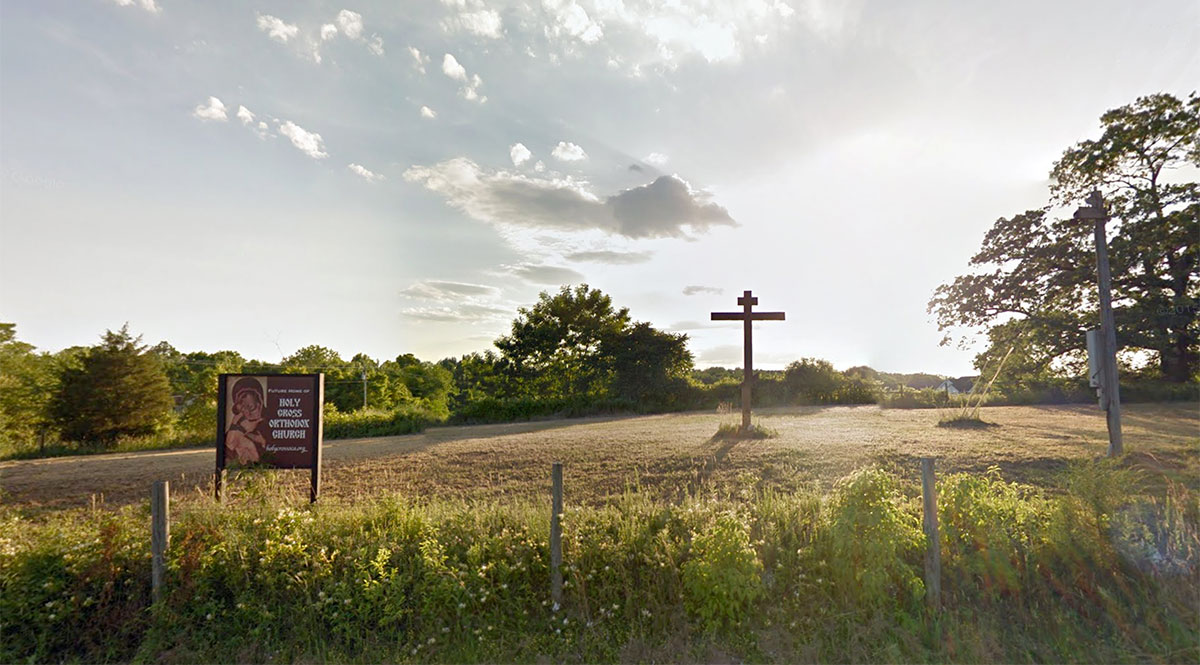 The Cross raised on our land